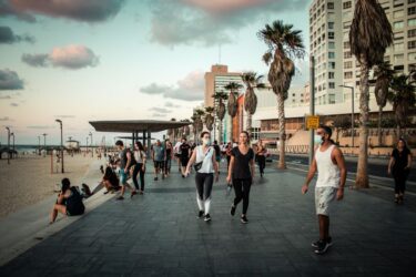 Tel Aviv Israel 04/10/2020 View of unidentified people without a face mask to protect themself walking on Herbert Samuel Promenade in Tel Aviv during lockdown and Coronavirus outbreak