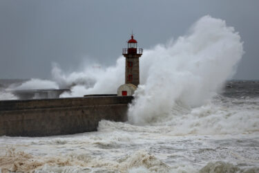 Stormy wave over lighthouses