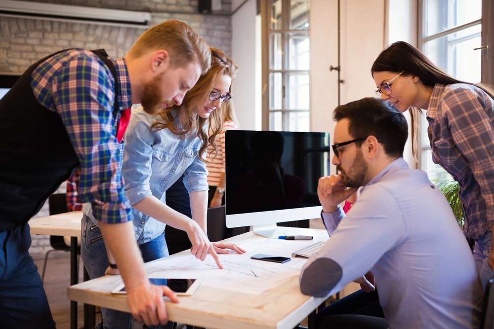 A group of students sitting around a study table